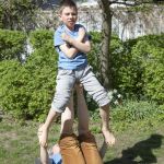 Tatjana t'Felt and her son Adam demonstrating acroyoga for families.
Photography by Emily Wilson Photography