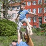 Tatjana t'Felt and her son Adam demonstrating acroyoga for families.
Photography by Emily Wilson Photography